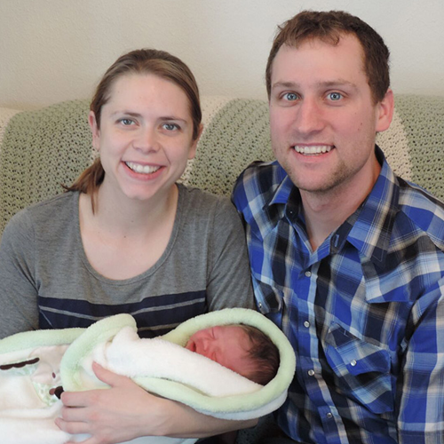 New parents Steva and Brian with their newborn son