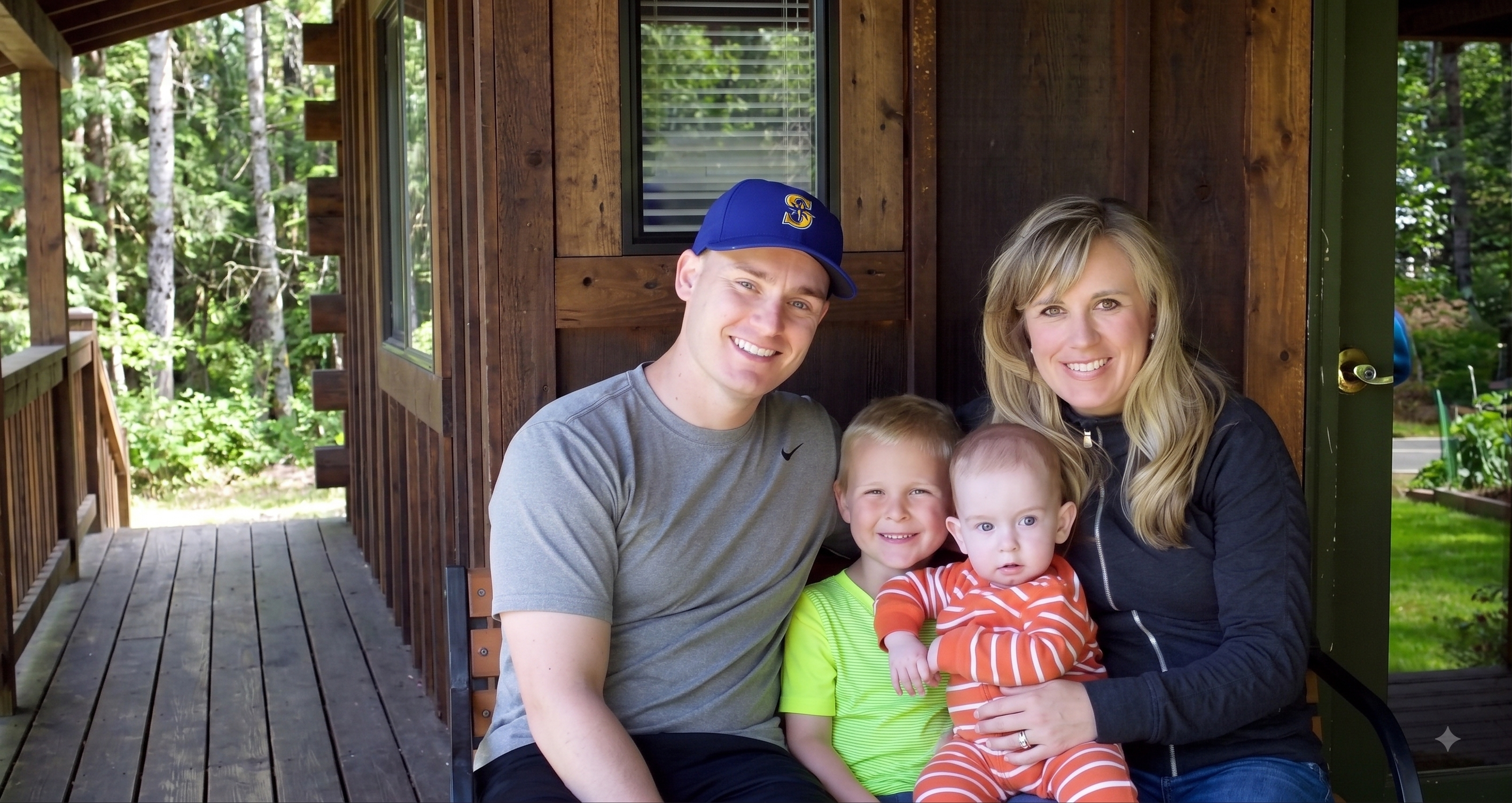 A family of four on a cabin porch