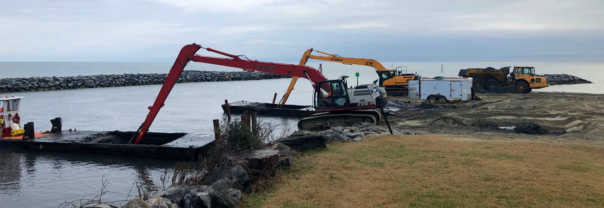 Triton long-reach excavators dredging at the shoreline